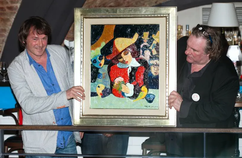 Gérard Depardieu and Igor Tcholaria with a painting